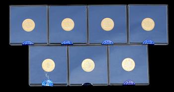 MYNT, 7 st, guld 900/1000, Sveriges Riksbank jubileumsmynt. Vardera 5,8 gram.