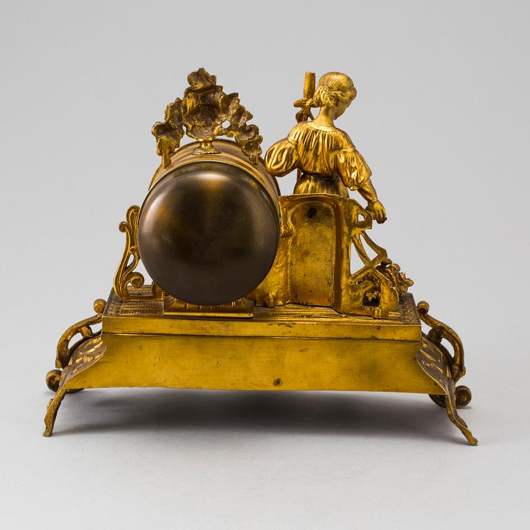 A LATE 19TH CENTURY GILT METAL MANTLE CLOCK in the Rococo style.
