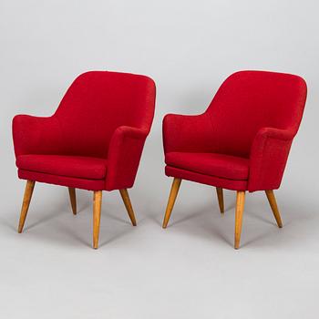 A pair of mid-20th century armchairs.