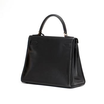 HERMÈS, a black leather bag, "Kelly 28".