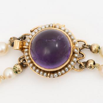 Cultured pearl necklace, double-strand with graduated pearls, Stigbert 18K gold clasp set with a cabochon-cut amethyst.