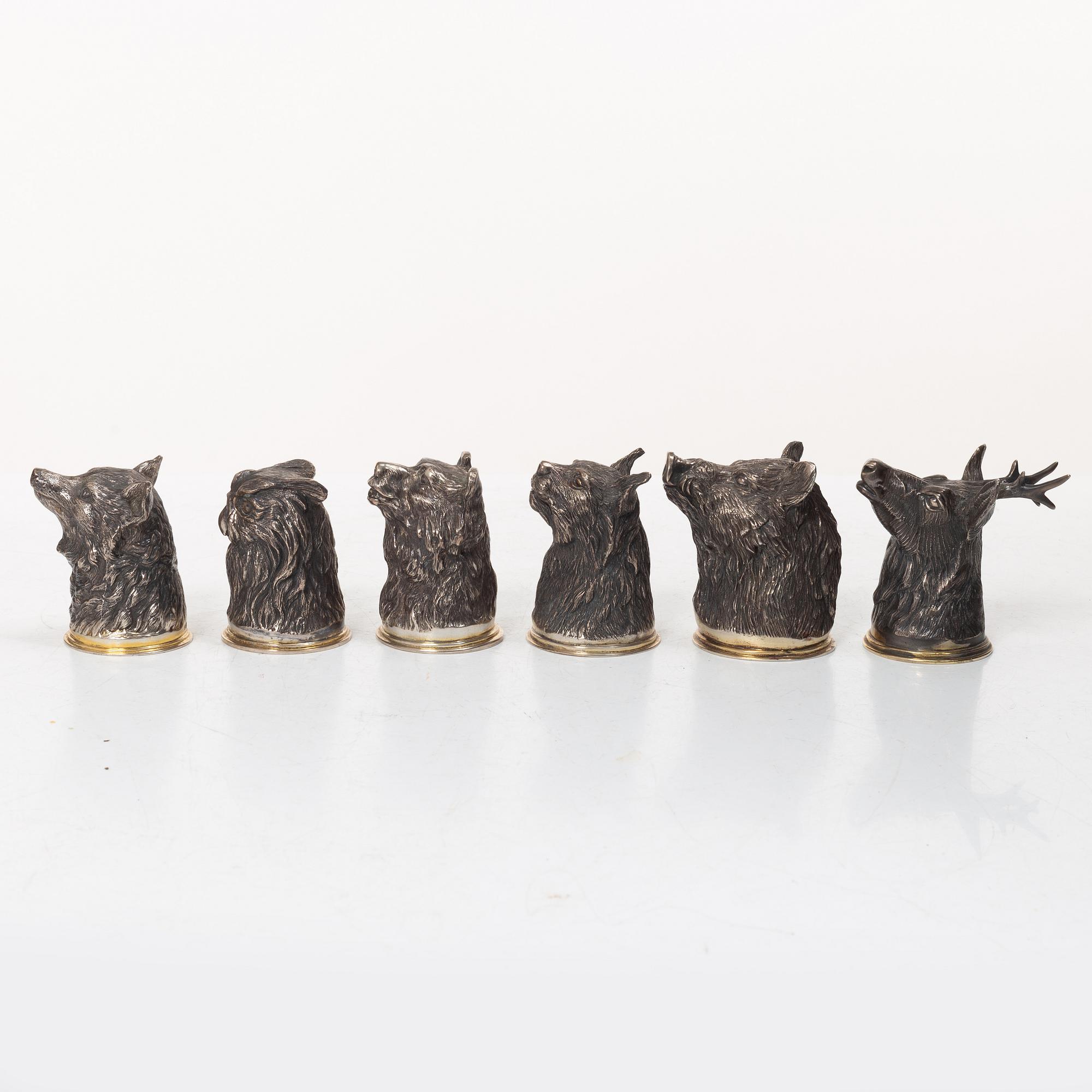 Six Russian parcel-gilt silver animal's head stirrup cups, including with mark of Nikols & Plinke, St. Petersburg.