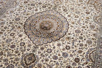 A semi-antique silk Keshan carpet, c. 350 x 248 cm.