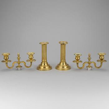 A pair of french 18th century brass candelabras.