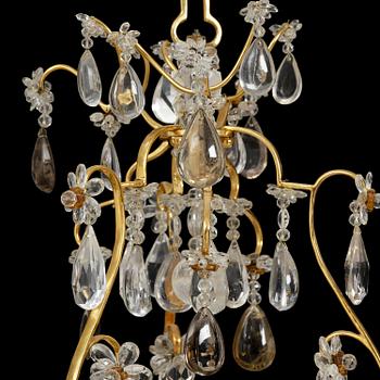A near pair of Franch Louis-XV-style nine-branch gilt bronze and rock crystal chandeliers, later part 19th century.