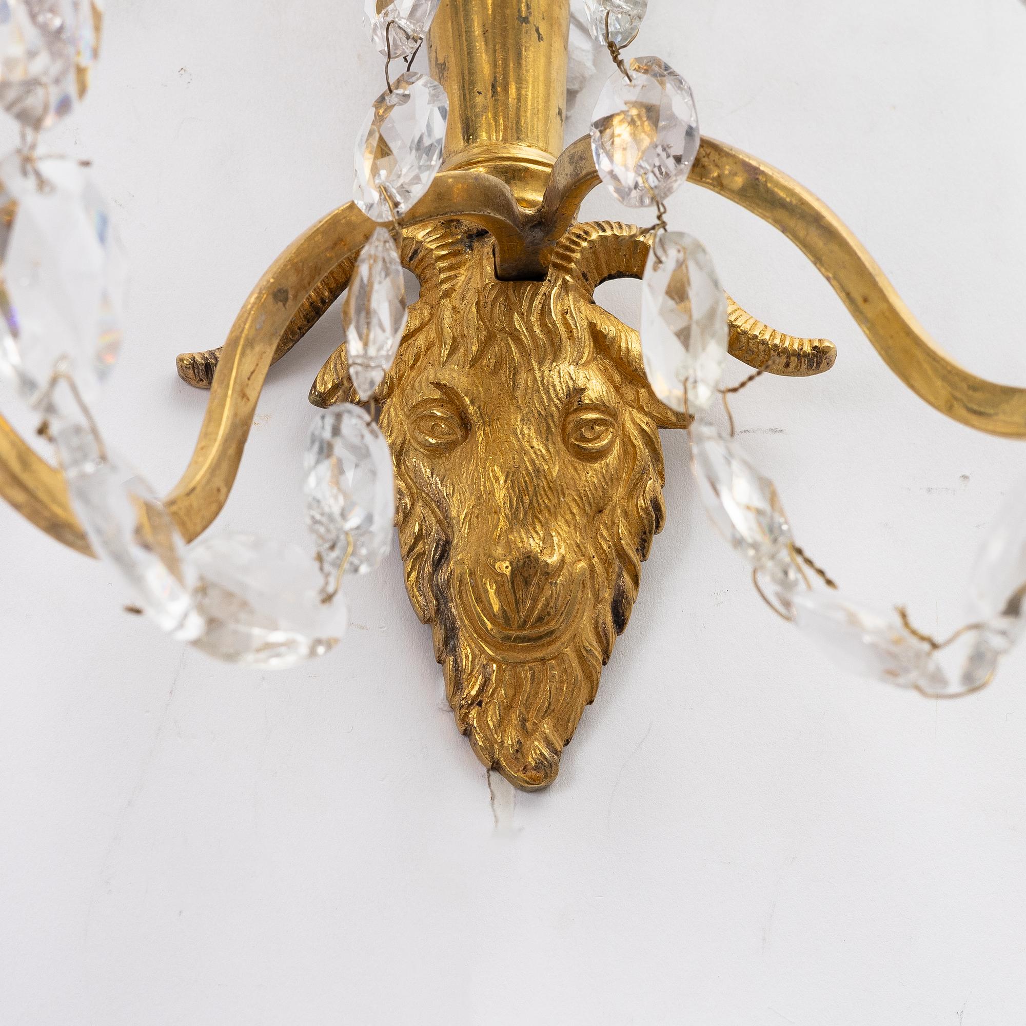 A pair of late Gustavian ormolu two-branch lustres, circa 1800.