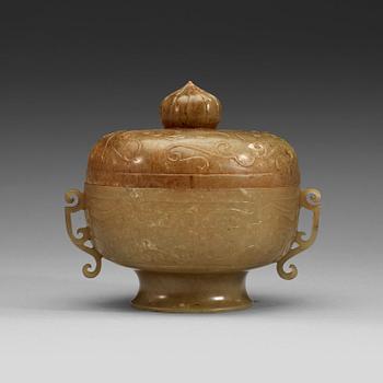 A carved archaistic nephrite bowl with cover decorated with taotie-masks, China, 20th Century.