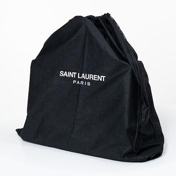 Yves Saint Laurent, a 'Sac du Jour' handbag.