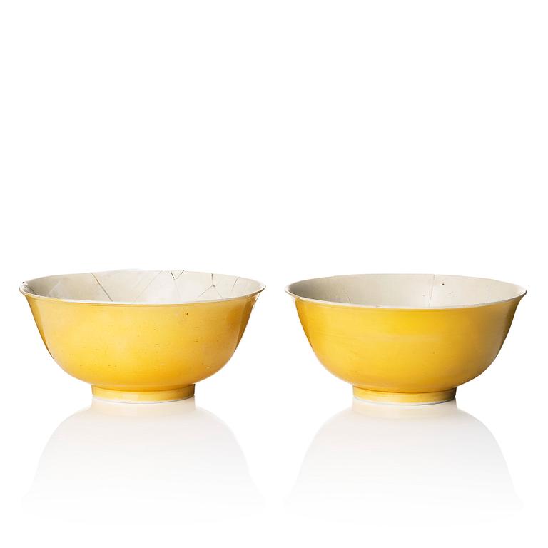A pair of yellow glazed bowls, late Qing dynasty with six character mark.