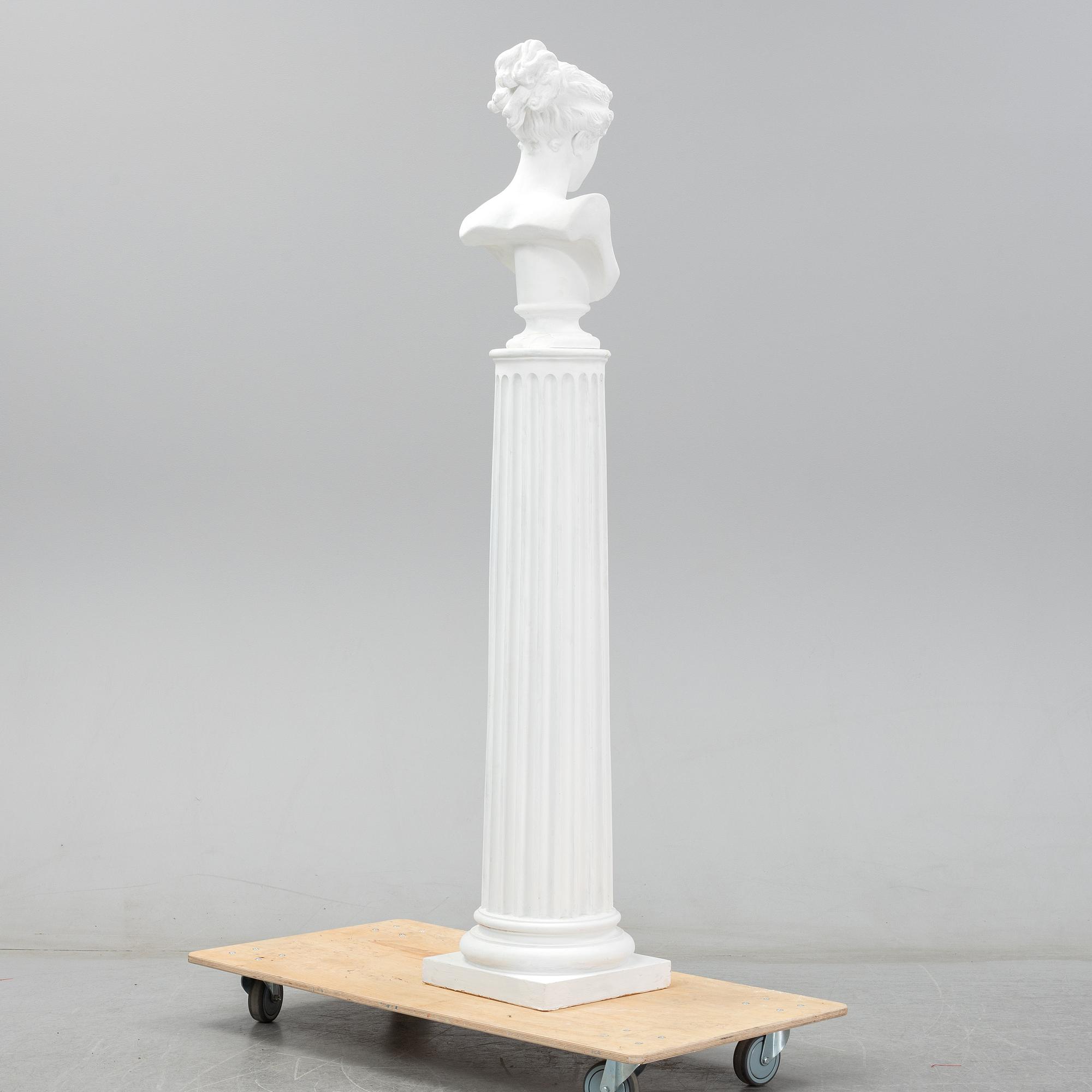 A plaster bust and pedestal.