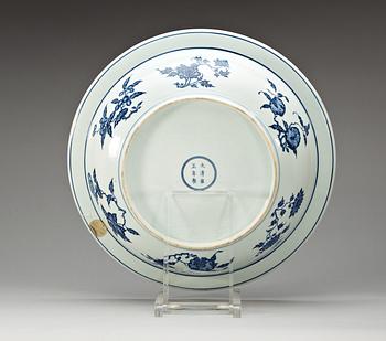 A large blue and white charger, Qing dynasty with Yongzheng six character mark.