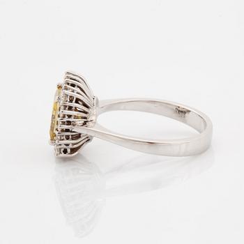 Princess-cut colour treated fancy deep brown-yellow diamond ring.