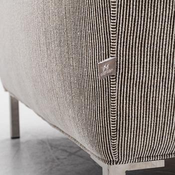 A 'Streamline' armchair with a foot stool, Eilersen.