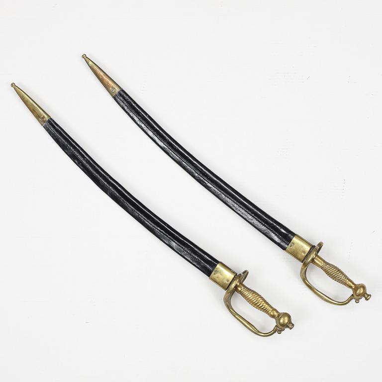 Two Swedish cutlasses 1748-1856 pattern with scabbards.