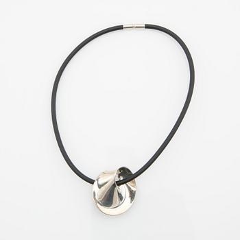 Vivianna Torun Bülow-Hübe, Pendant/brooch, "Möbius", and rubber necklace, by Georg Jensen, Denmark.