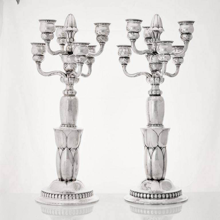 Georg Jensen, a pair of six lights silver candelabra, Copenhagen 1920, design nr 38.