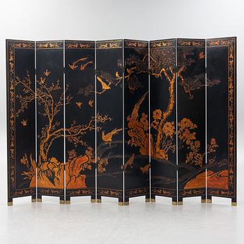 A Chinese lacquer folding screen, 20th century.