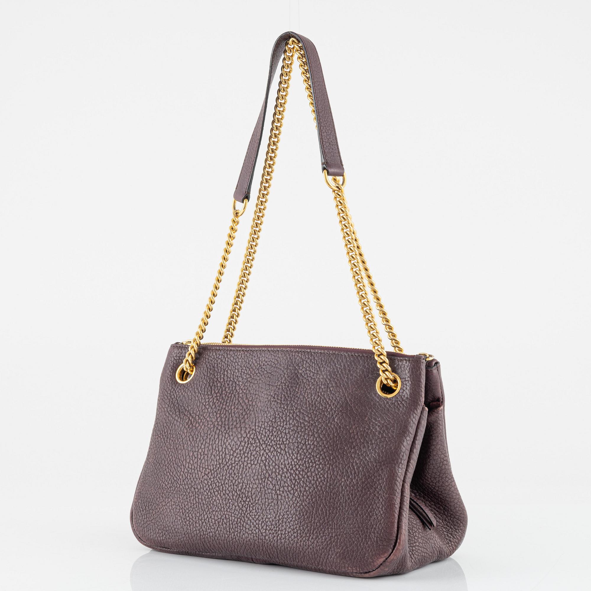 Mulberry, a burgundy leather handbag.