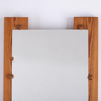 A pine mirror by Gunar Kanevad, signed and dated 1971.