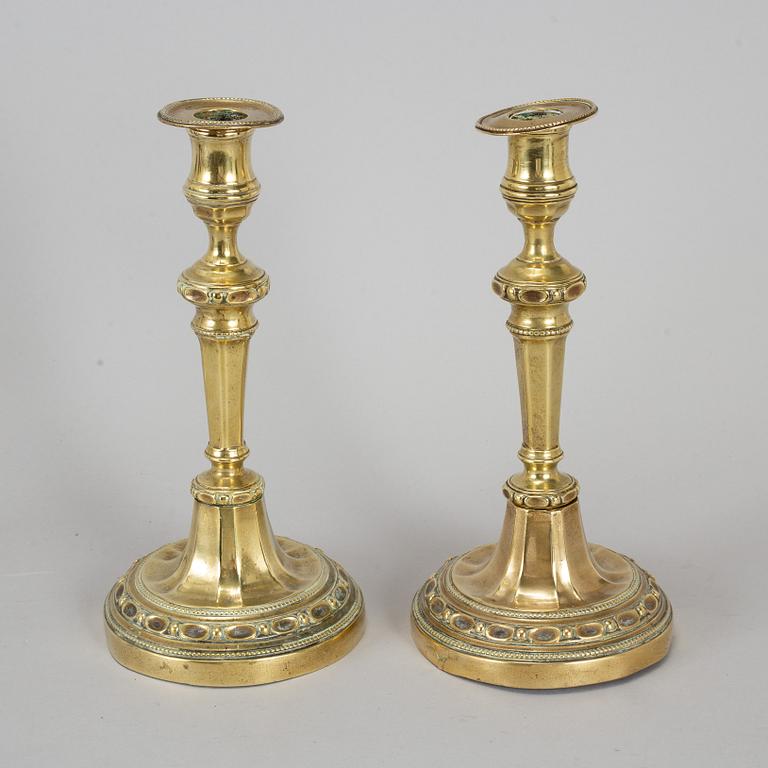 A pair of Louis Seize bronze candlesticks, late 18th century.