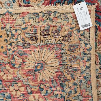 A carpet, a semi-antique Kerman, ca 375-379,5 x 268-271 cm.