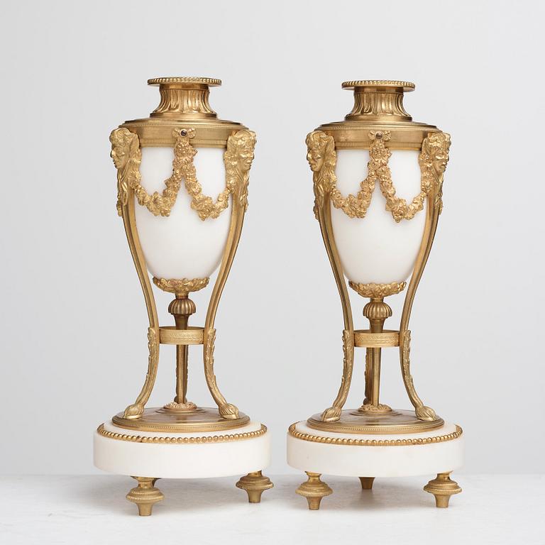 A pair of Louis XVI-style candlesticks, circa 1900.