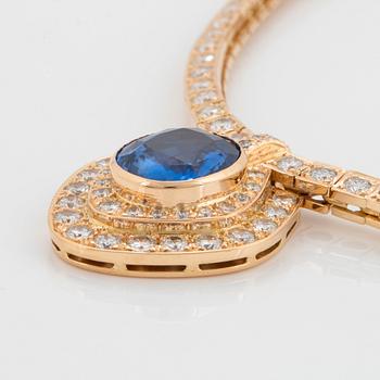 An 18K gold necklace set with a faceted sapphire ca 8.00 cts and round brilliant-cut diamonds.