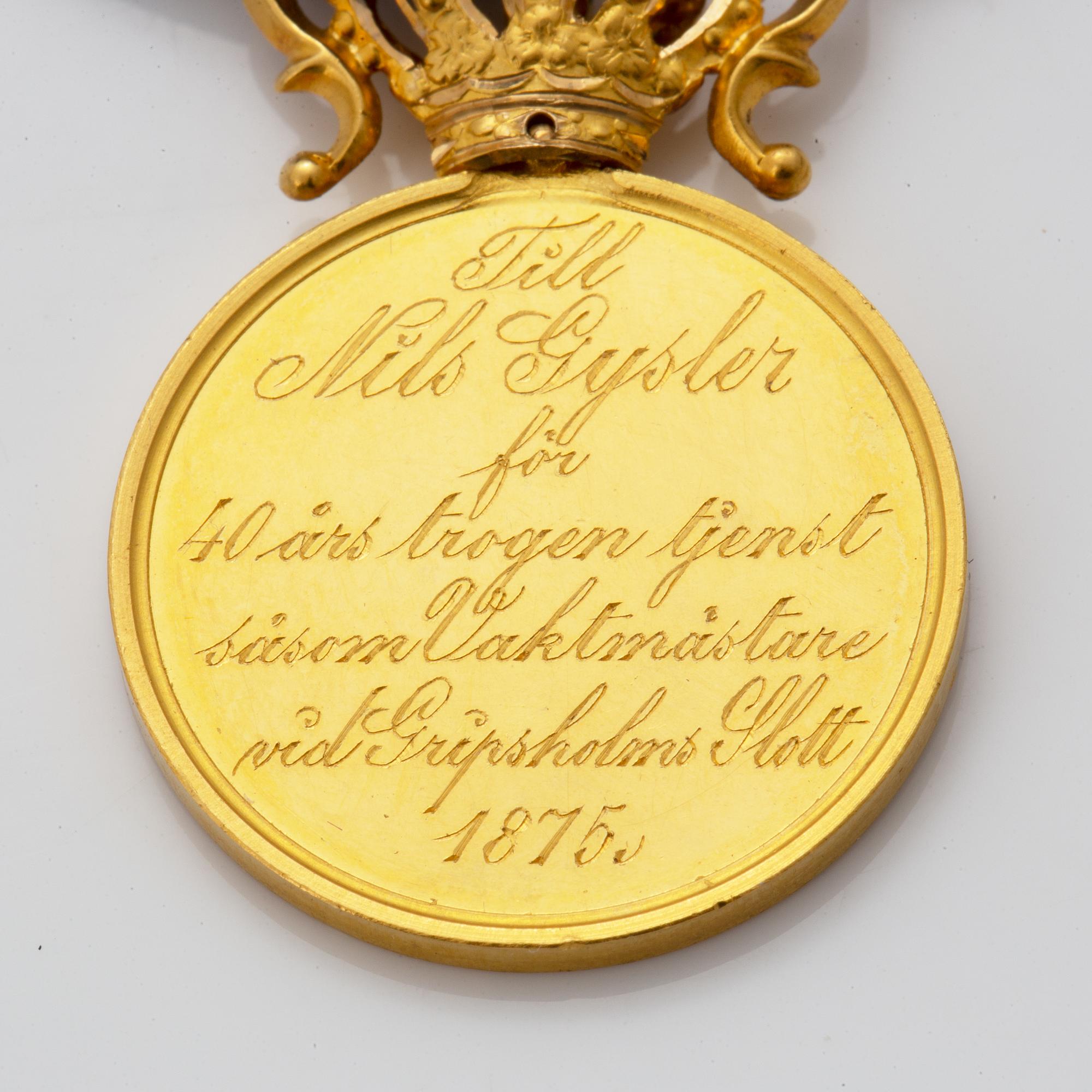 A Swedish Royal gold medal and a gilt silver decoration.