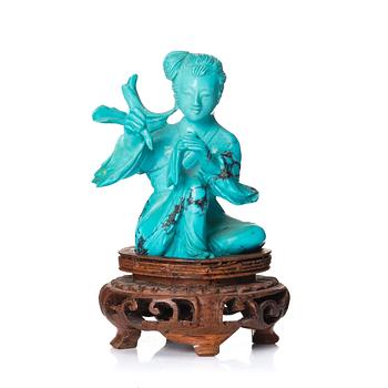 1033. A Chinese turquoise stone figure, 20th century.