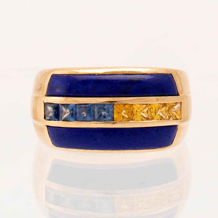 An 18K gold ring set with princess-cut blue and yellow, likely, sapphires as well as Lapis Lazuli.