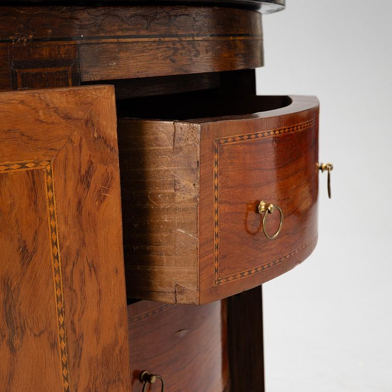A small cabinet with drawers from around the year 1900.