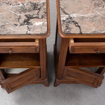 A pair of walnut marble top bedside tables, first half of the 20th Century.