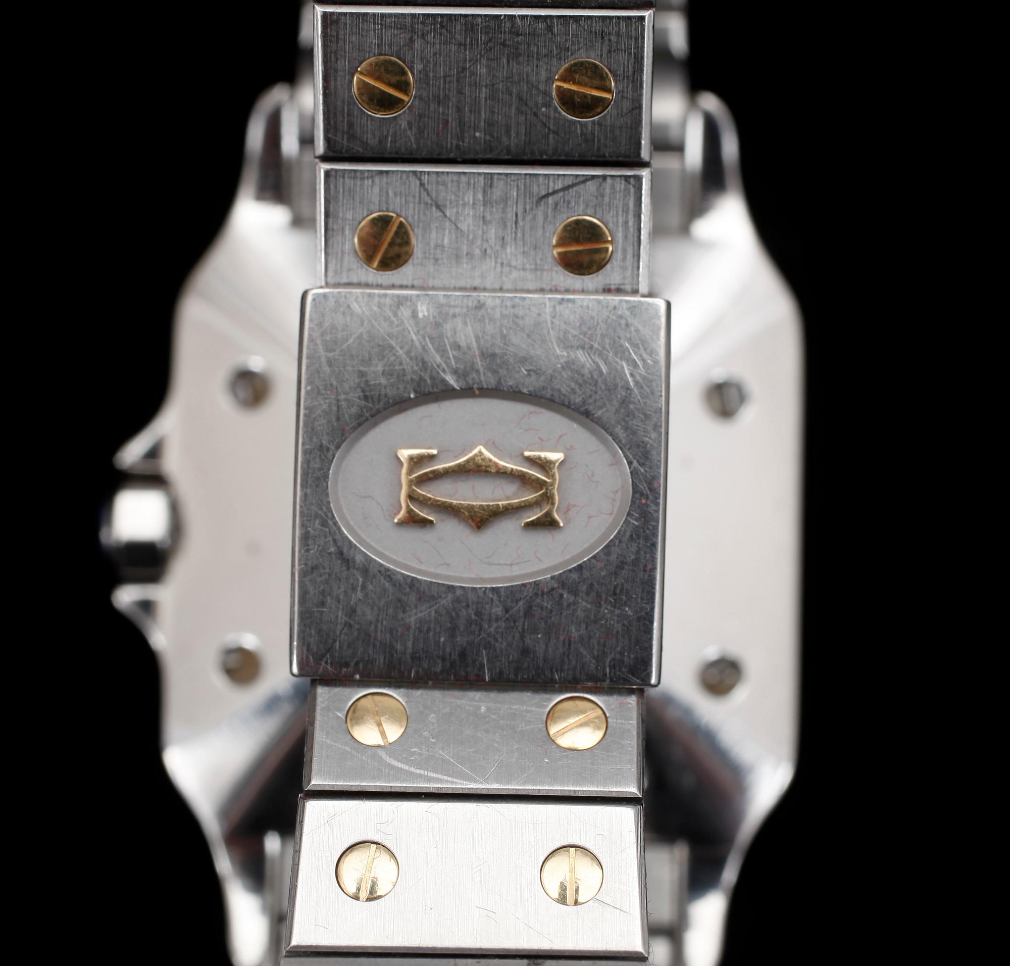 ARMBANDSUR, herr, Cartier, Santos, automatisk, stål och guld.