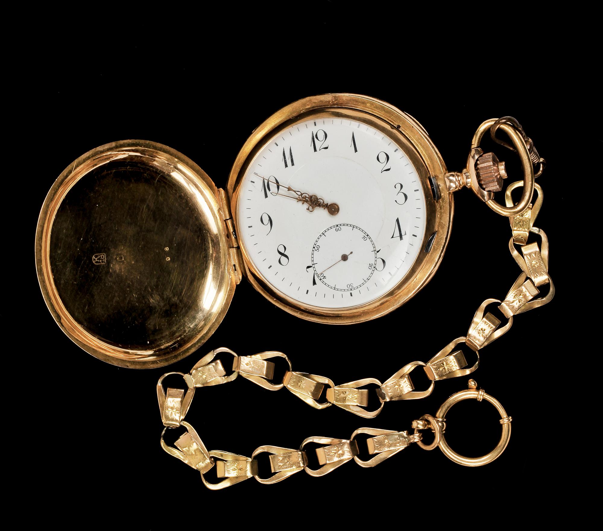 FICKUR MED KLOCKKEDJA, 18 K guld, omkring sekelskiftet 1900. Kedjans vikt 14 gr.