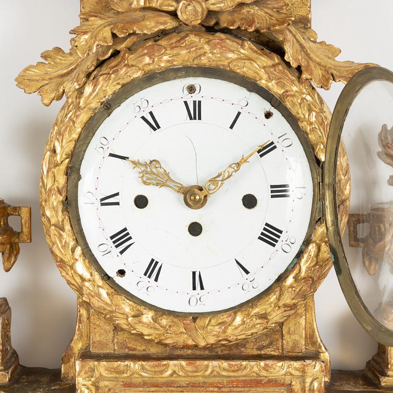 A presumably French Louis XVI giltwood wall clock, late 18th century.