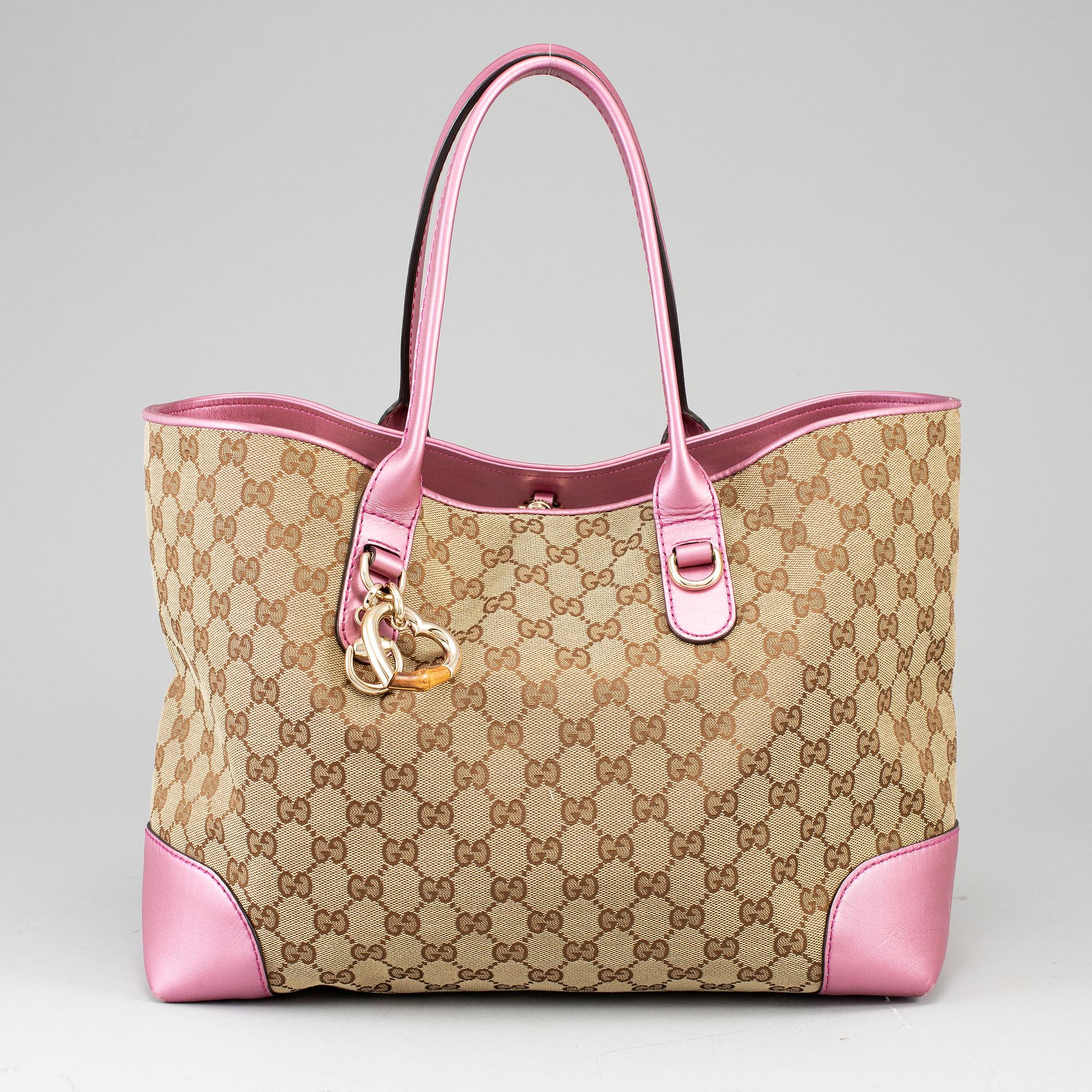 GUCCI, a monogram canvas and pink metallic leather handbag.