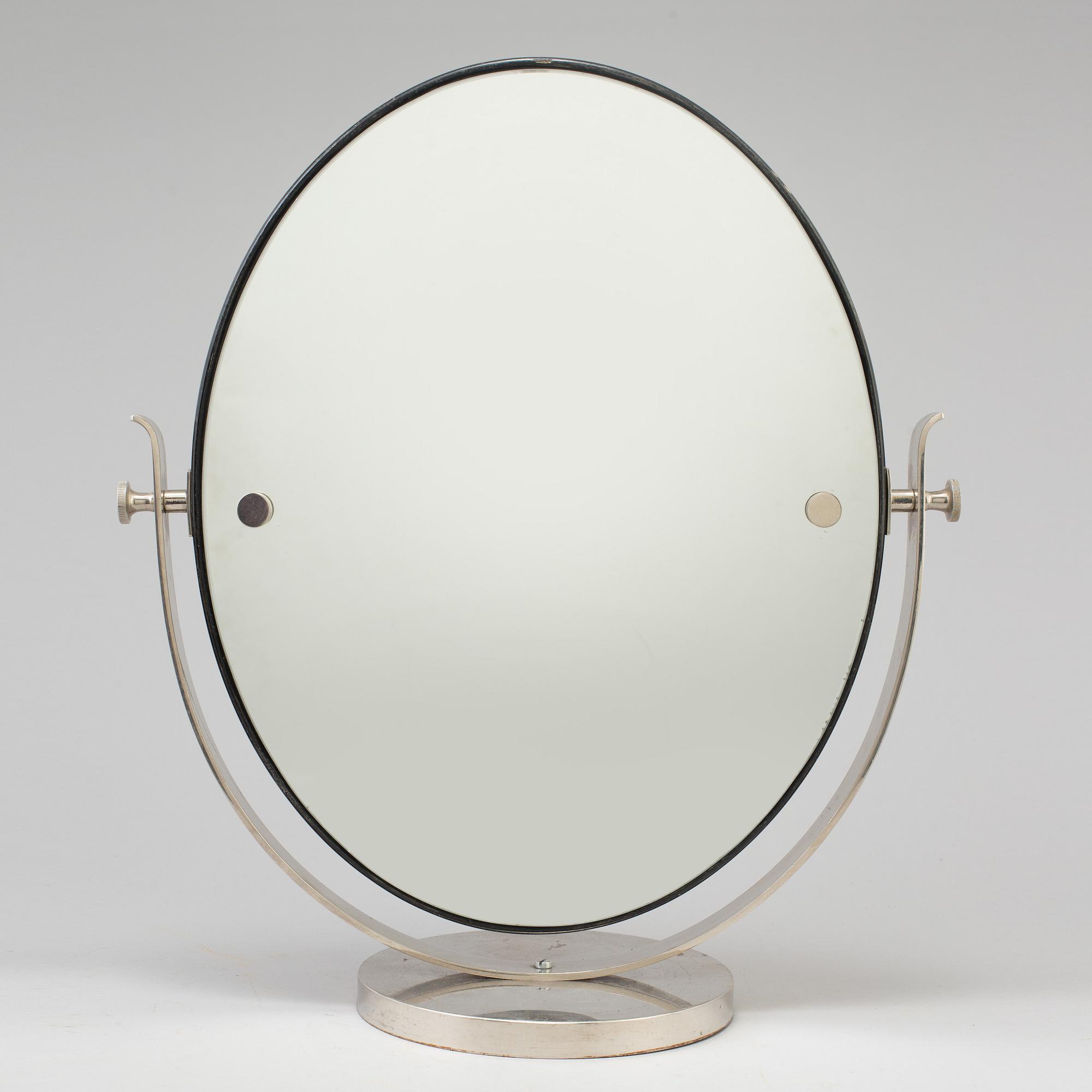 A 1930s art déco table mirror.