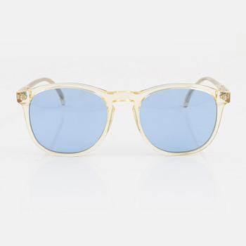 Illesteva, a pair of sunglasses.