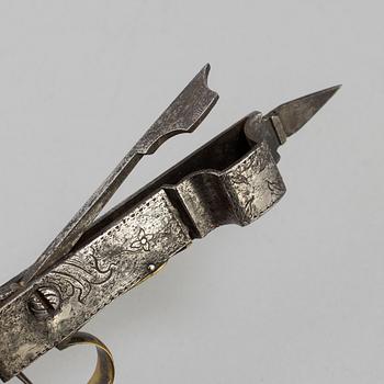 An 18th century candle scissor.