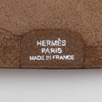 HERMÈS, a grey wallet and notebook cover, "Dogon" and "Ulysse".