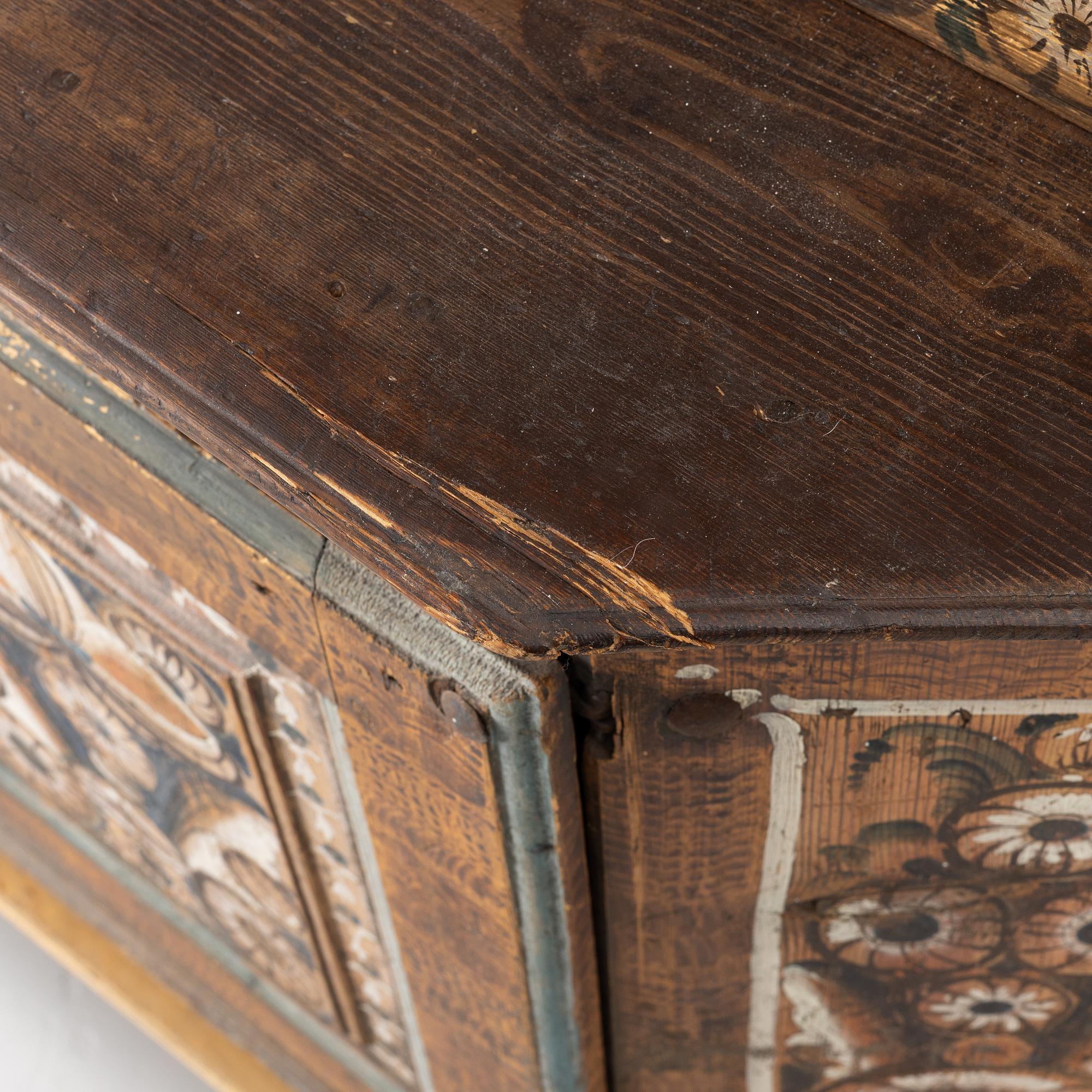 A Swedish Dalecarlian folk art cabinet dated 1808.