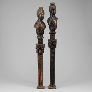 A pair of dark wood balusters, 18th century.