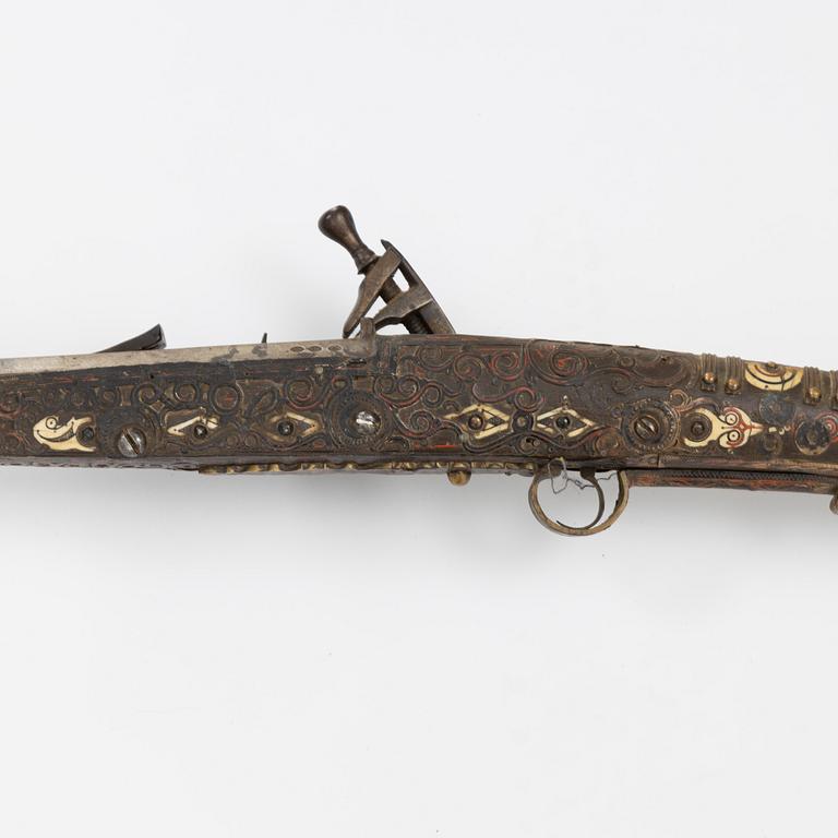 A snaphaunce gun, 19th Century.