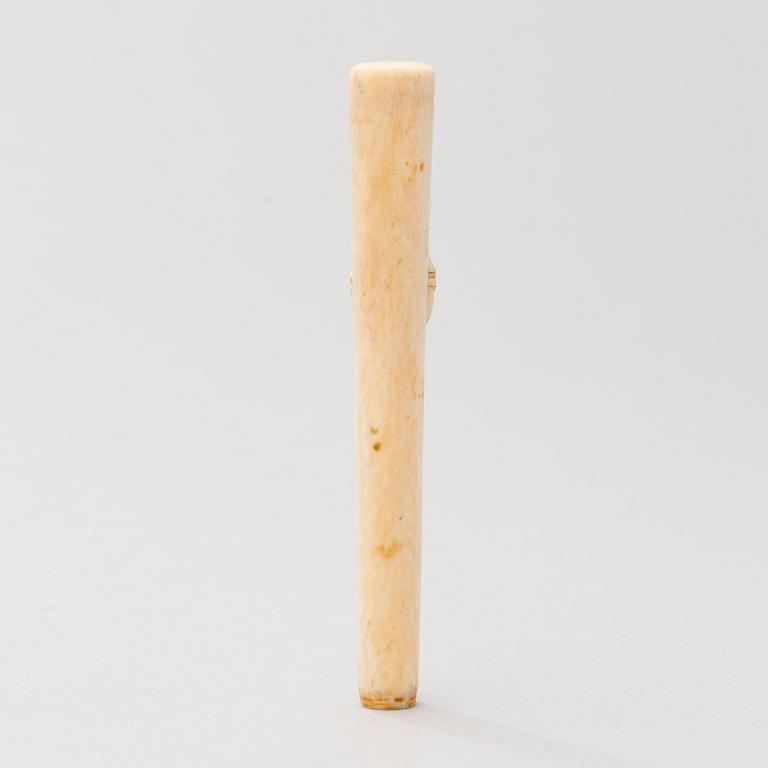 A Russian carved bone pen handle.