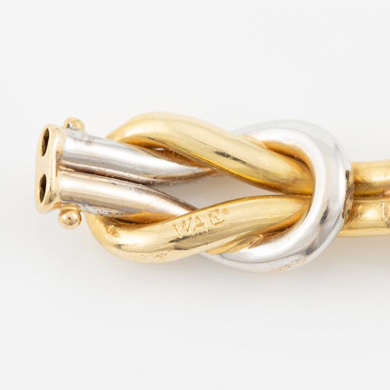 A bracelet in 18K gold and white gold.