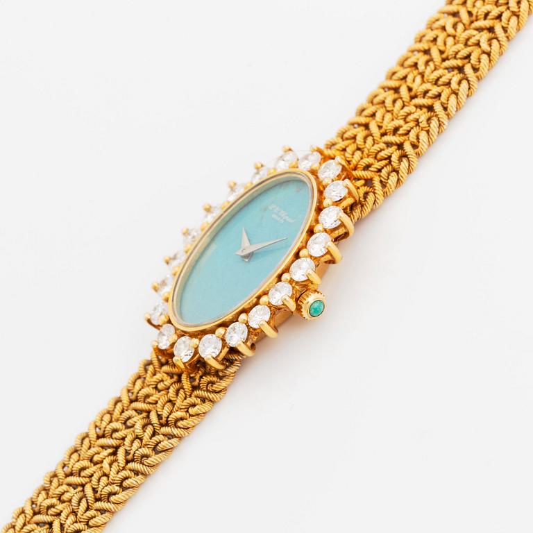 A Chopard for Kutchinsky 18K gold watch with a turquoise dial and a diamond bezel.