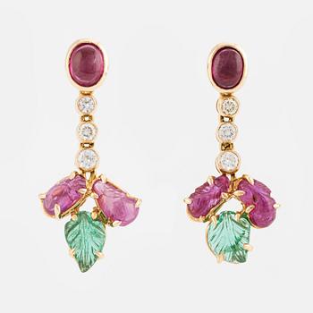 Earrings with cabochon-cut and faceted rubies, emeralds, and brilliant-cut diamonds.