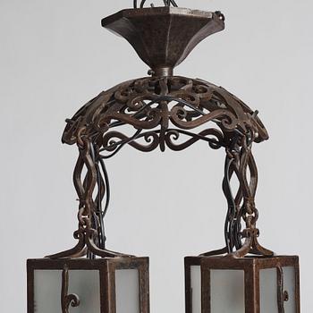 Carl Westman, attributed to, a wrought iron and frosted glass Art Nouveau chandelier, Sweden ca 1915.