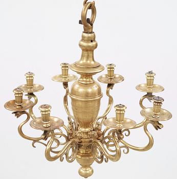 A 19th century eight-light brass chandelier in the manner of Hans Rogiers van Harelbeke.