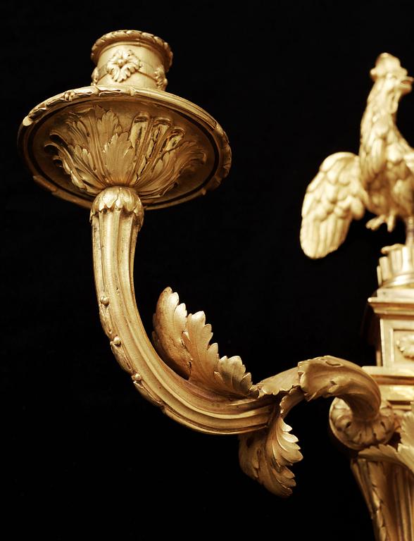 A pair of Louis XVI gilt bronze three-light wall-lights attributed to Jean-Louis Prieur, Paris circa 1770.